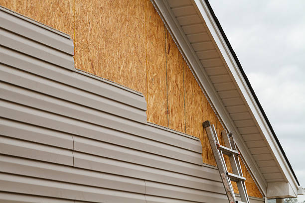 Professional Emergency Siding Repair technician working in Belmont, MA